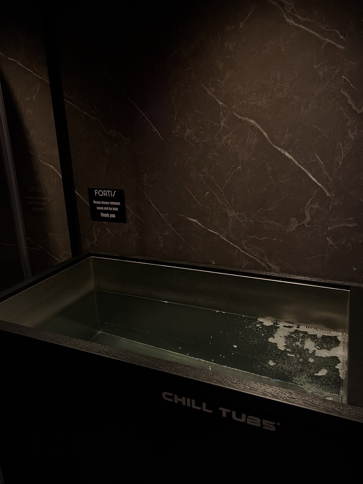 Ice bath against marble walls
